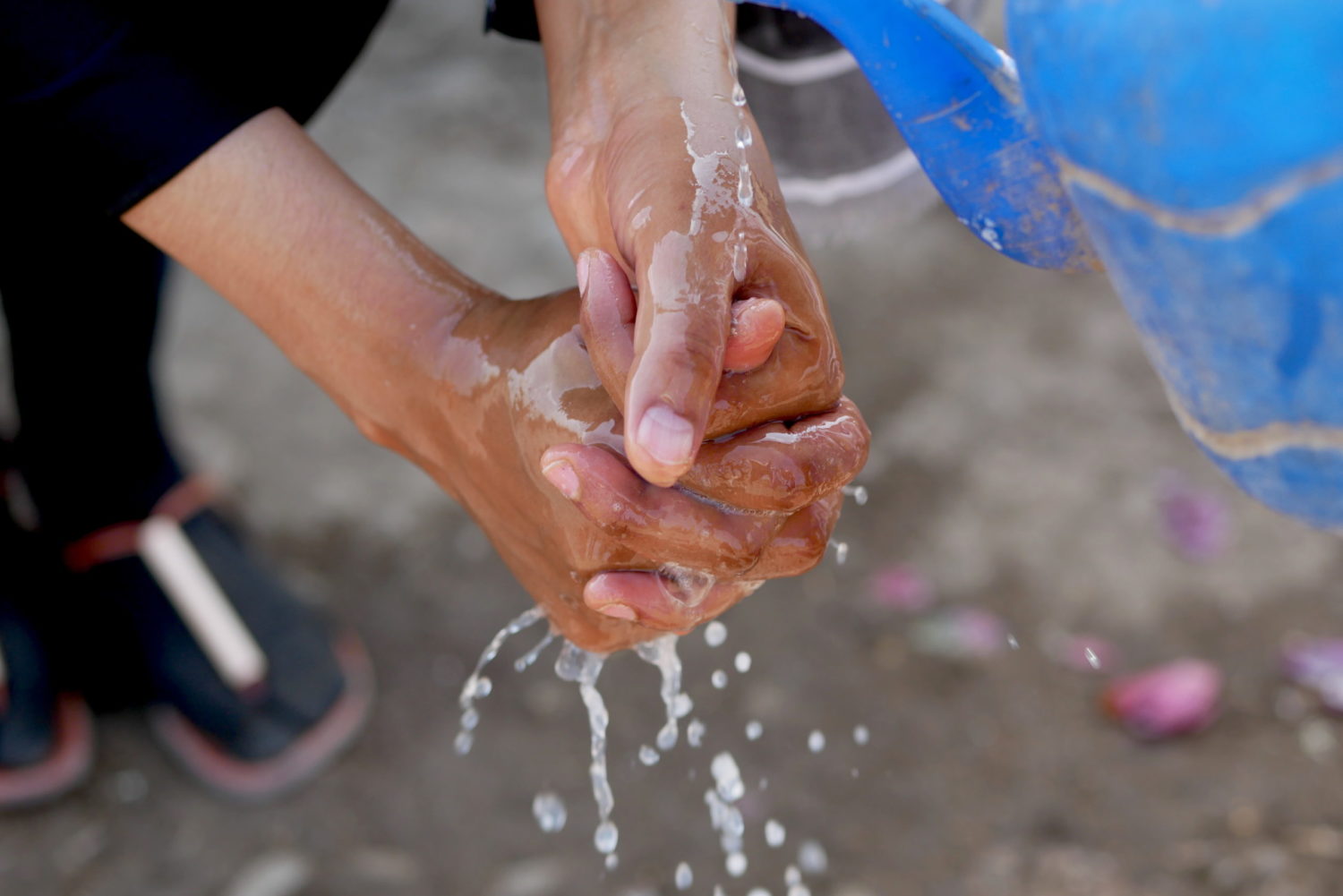 Close-up shot of hands being washed